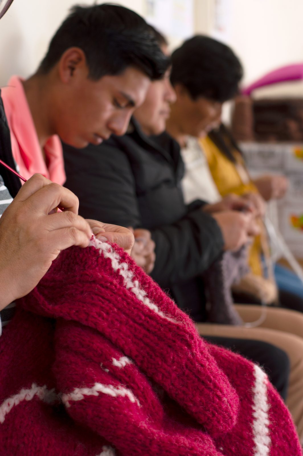 Members of the knitting collective at work on a commission